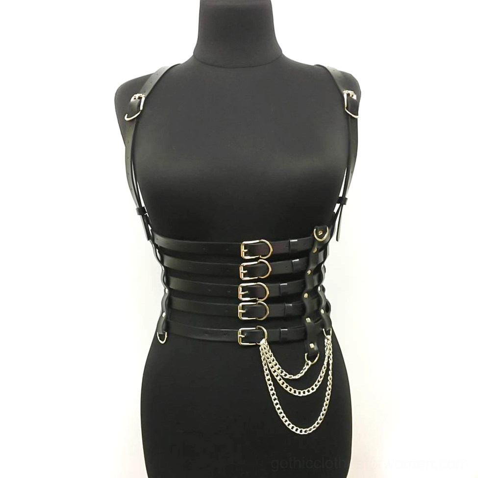 Black synthetic leather chest harness frontal display with gold-toned buckles and decorative hanging metal chain details