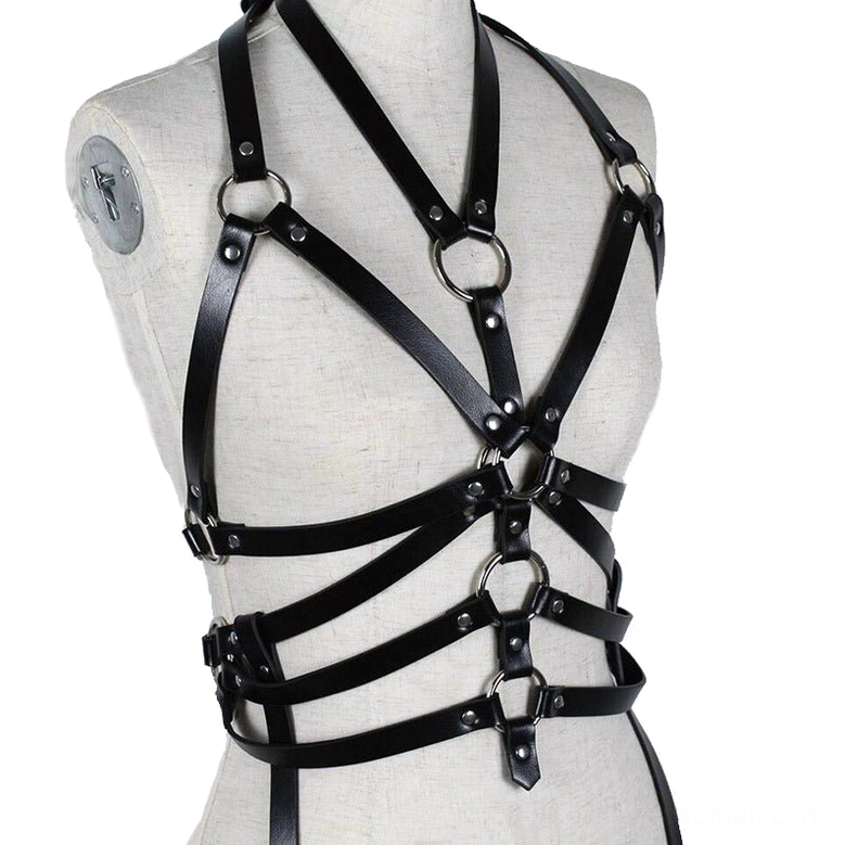 Black leather chest harness on dress form, cross shoulder straps with metal ring hardware