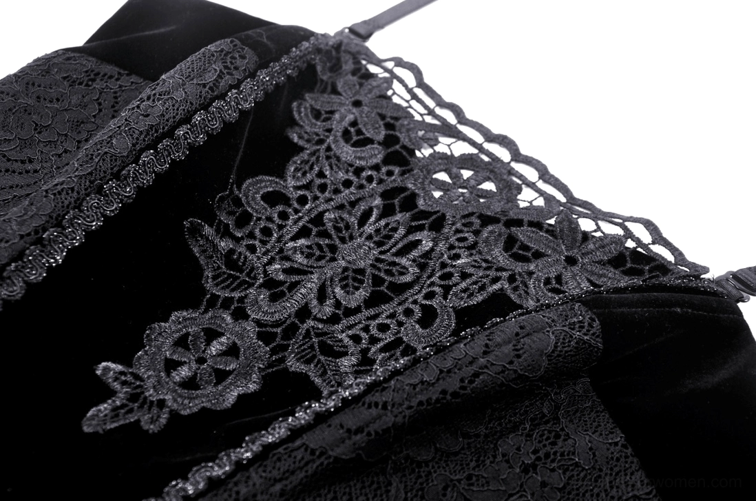 Close-up detail of black corset lace embroidery and spaghetti strap texture