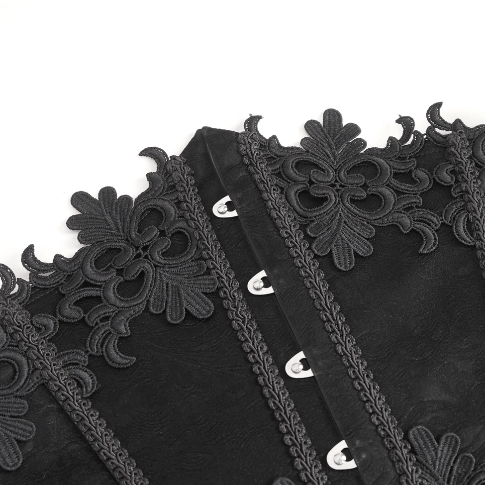 Detailed close-up view of black underbust corset front fasteners showing metal hooks and embroidered floral lace decoration