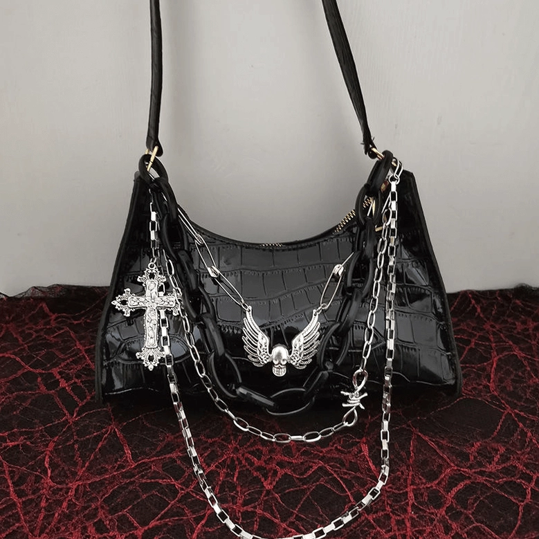 Black glossy crocodile textured gothic bag with complete layered chain system and winged skull ornaments