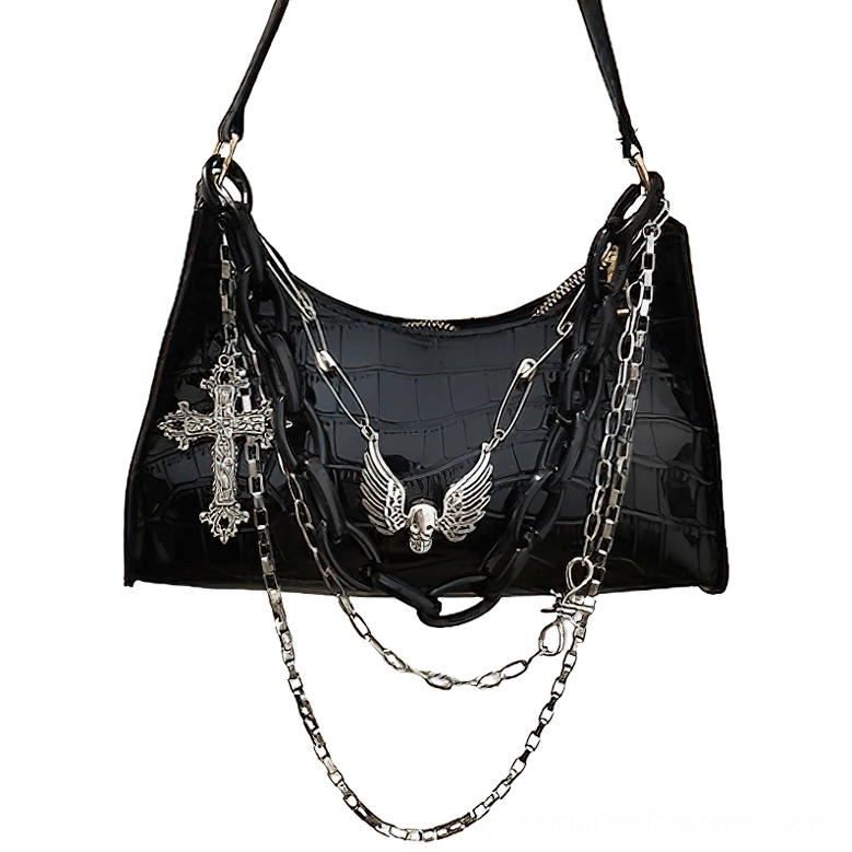 Black crocodile embossed gothic shoulder bag with detachable layered metal chains, winged skull and cross charms, front flat view