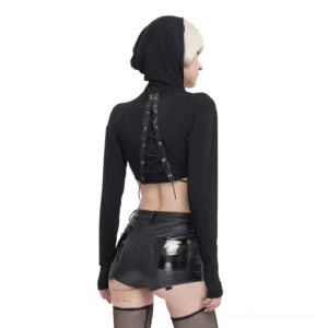 Back view of lace-up crop top showing back tie-up fastening detail, paired with leather shorts and fishnet stockings