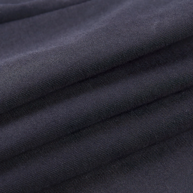 Fabric texture and material close-up of black bodycon crop top showing smooth stretch fabric