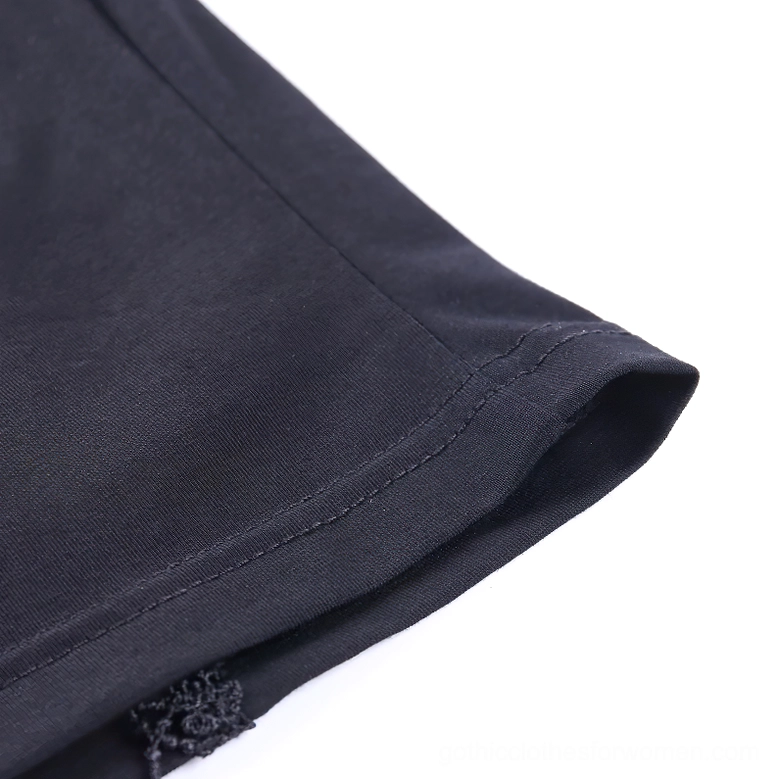 Sheer lace cap sleeve hem detail on black gothic crop top showing neat stitching and lace trim