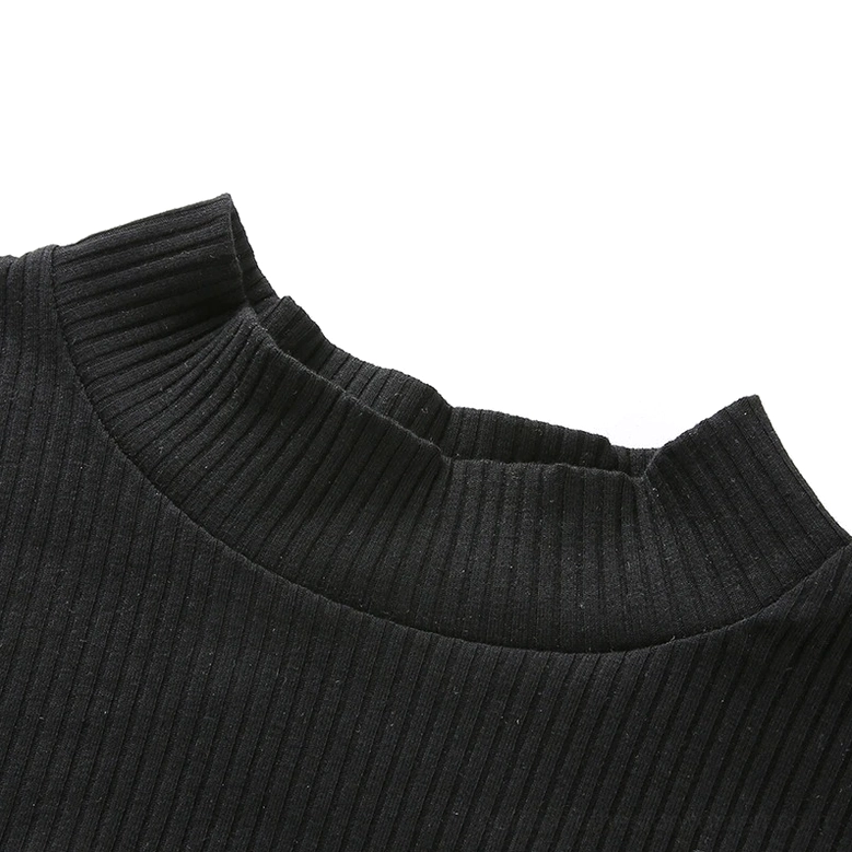 Close-up of black ribbed knit mesh crop top fabric texture and high mock neck detail