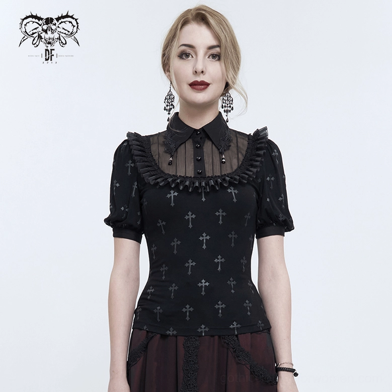 Black cross gothic blouse paired with black tulle skirt, model wearing dangle cross earrings and accessories