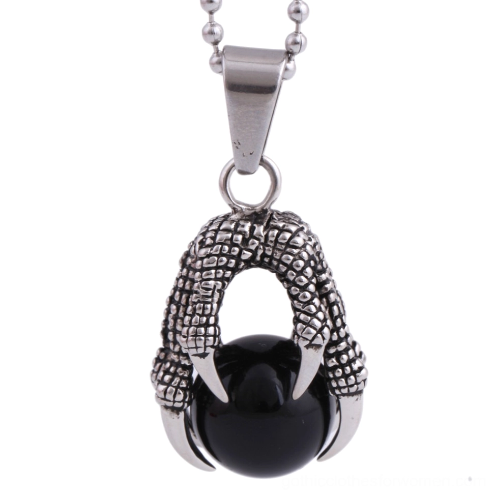 Top view of black crystal dragon claw pendant necklace with symmetrical claw design holding stone