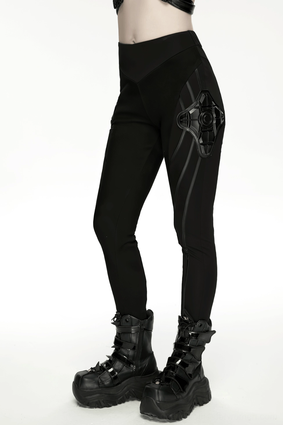 Black cyberpunk armor leggings product detail flat lay showing overall construction and integration of 3D armor elements with base fabric