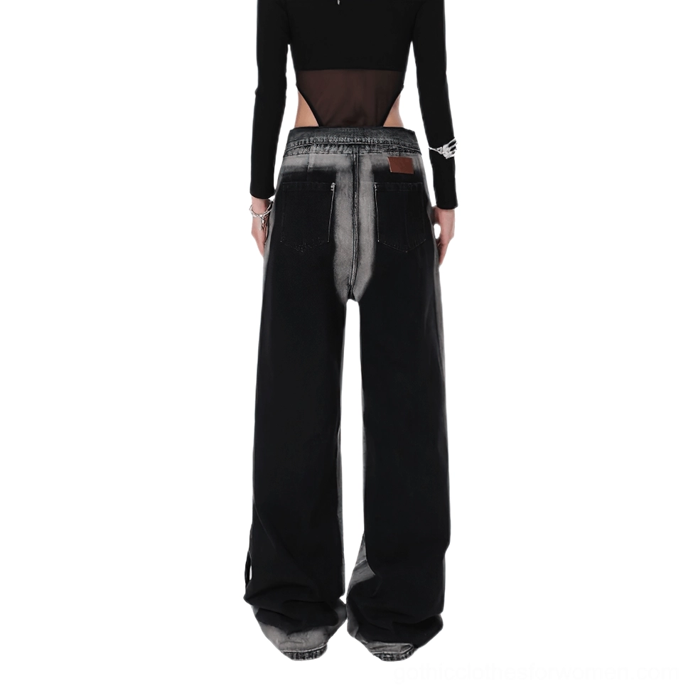 Full back view of women's black high-waist denim trousers with gradient faded wash and leather back patch detail