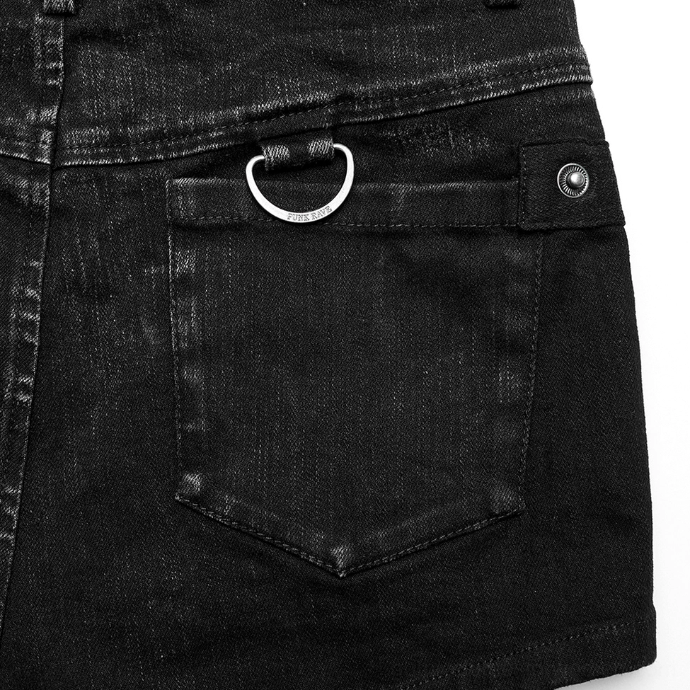 Black denim harness shorts hardware components - buckles and D-rings closeup