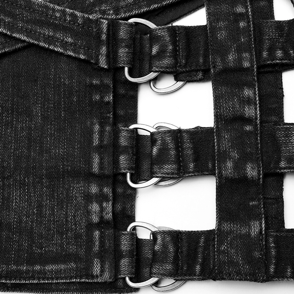 Black washed denim metal hardware and D-ring strap detail closeup on gothic shorts