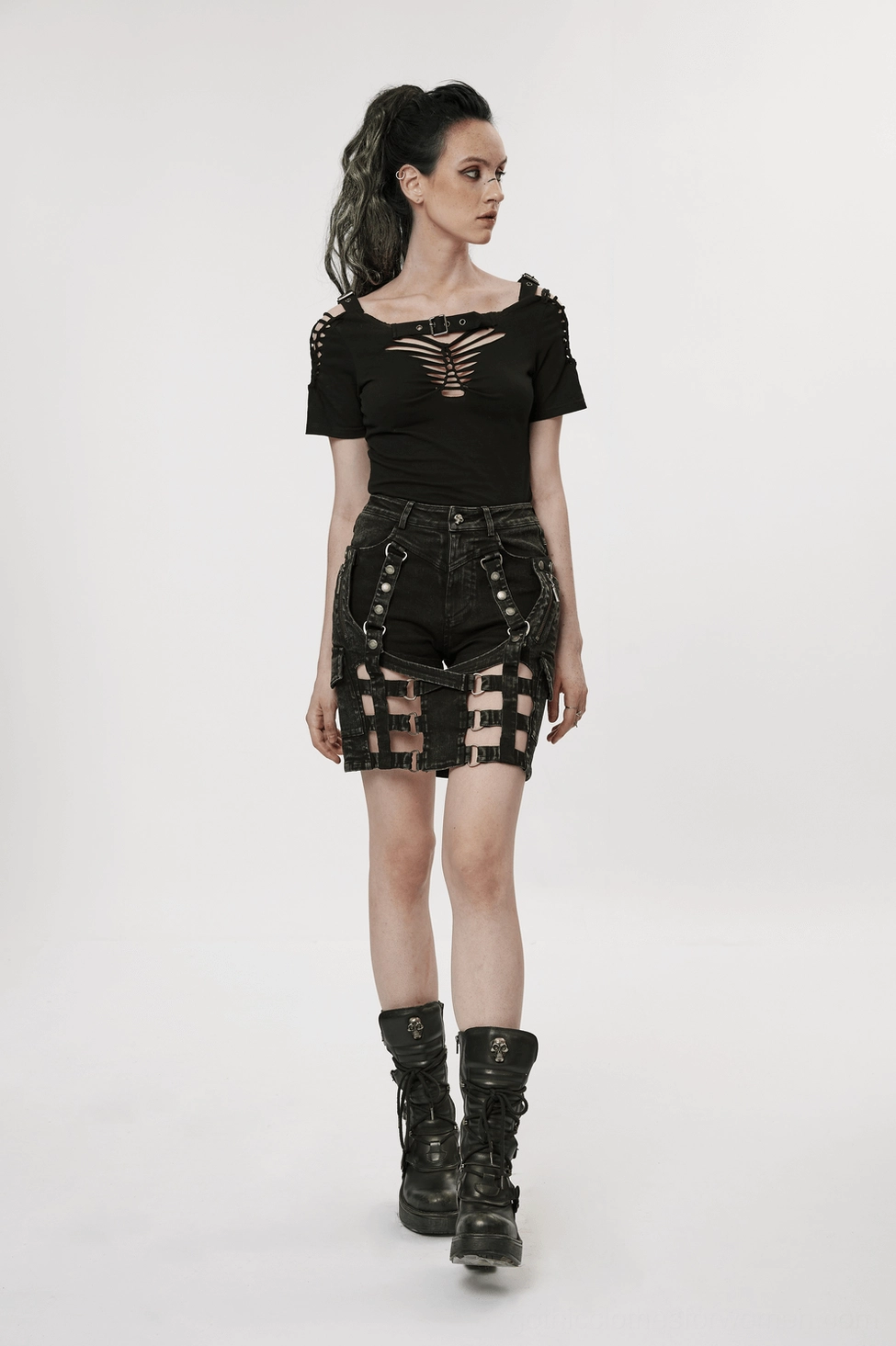 Black gothic denim shorts-skirt with harness styling on model - alternative fashion
