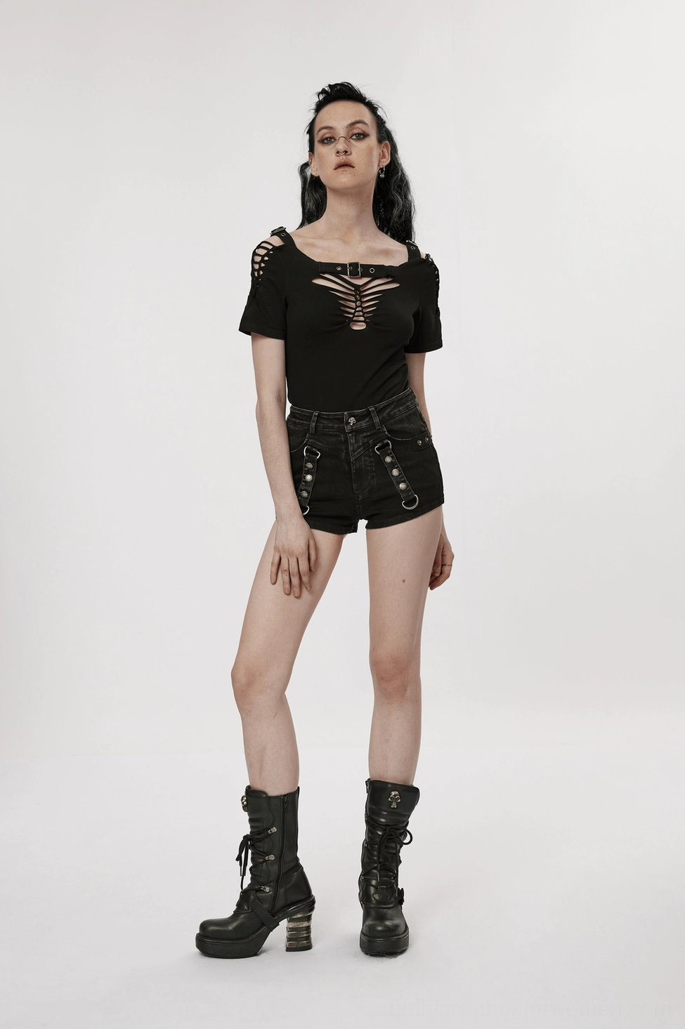 Black washed denim harness shorts-skirt showing cutout design and silver hardware styling