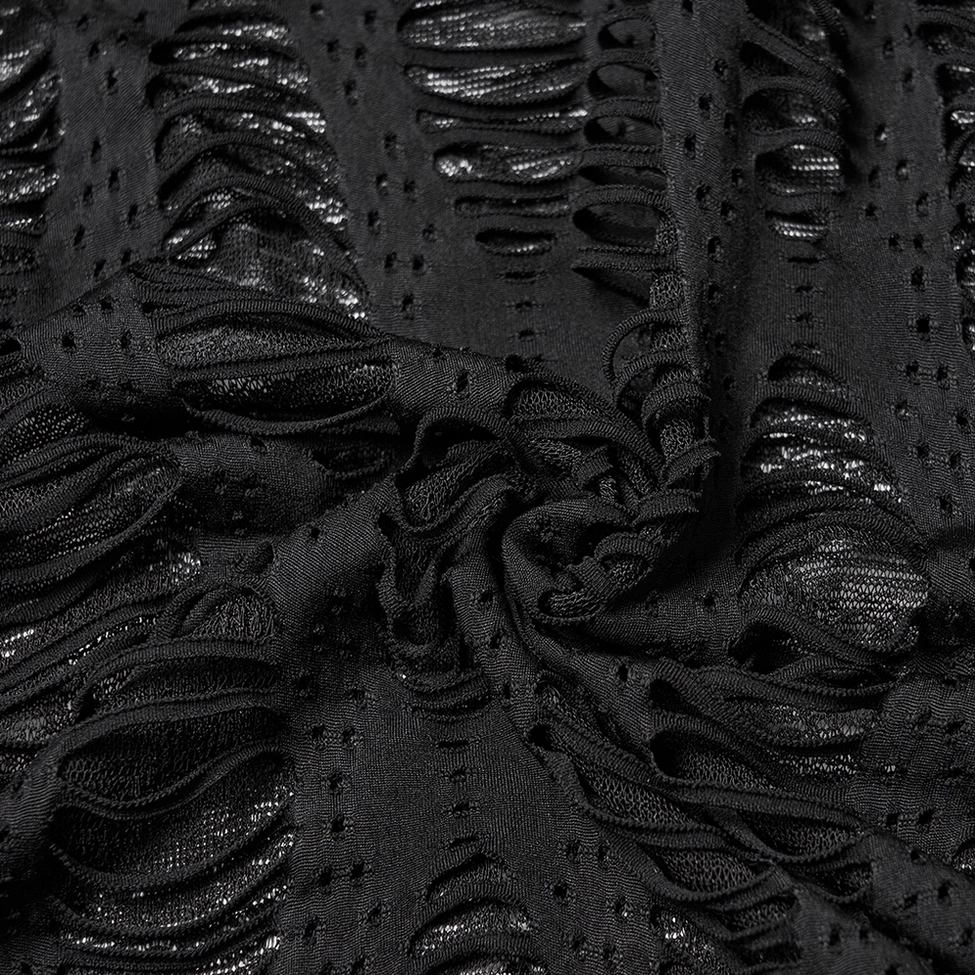 Black destroyed knit fabric close-up - irregular destroyed hole texture and matte black knit detail