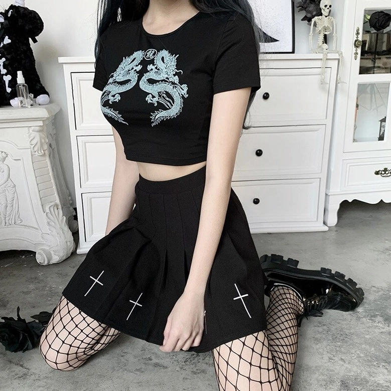 Black dragon print cropped tee styled with fishnet stockings and combat boots, showcasing alternative gothic outfit coordination