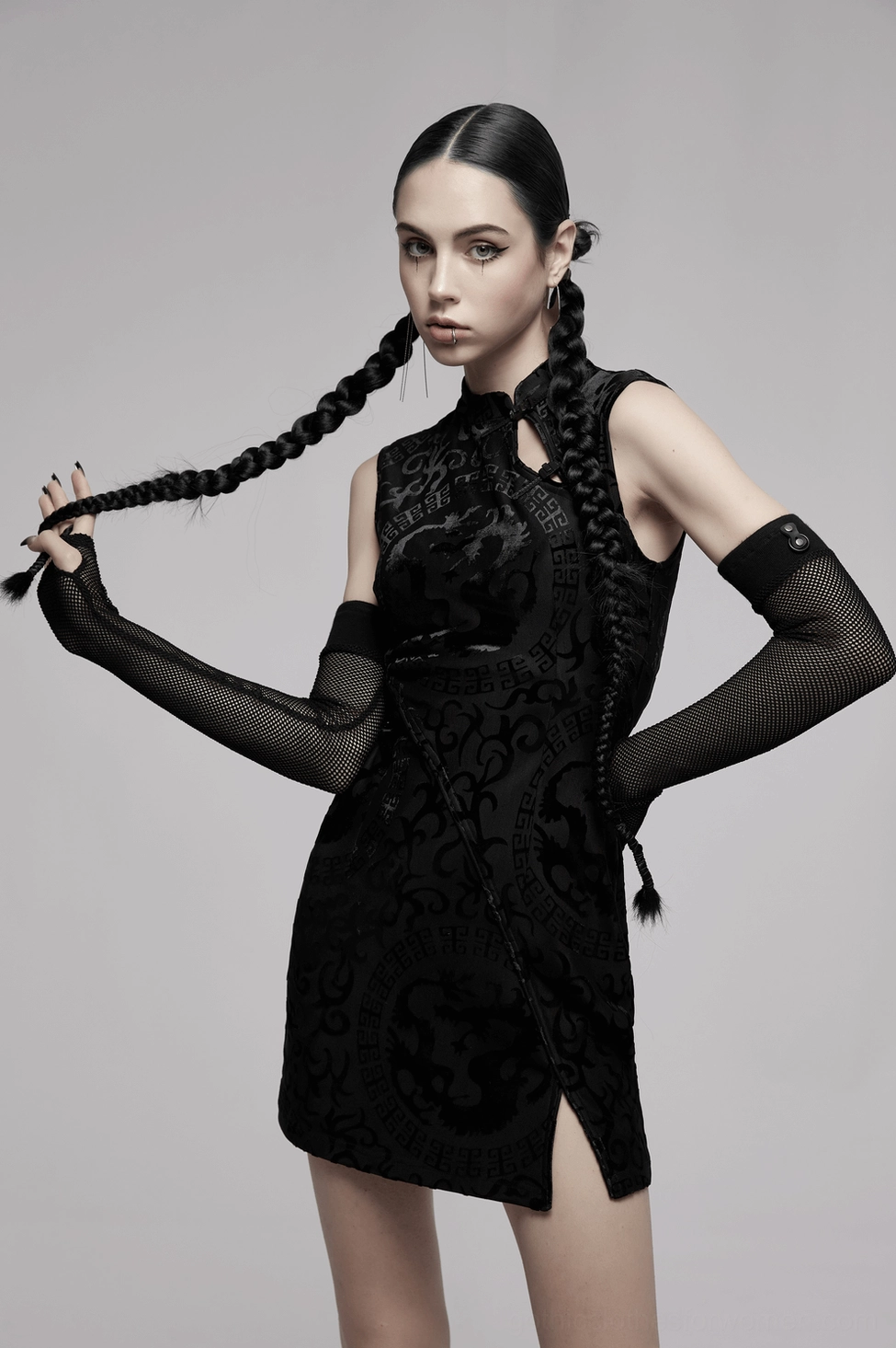 Black dragon velvet mini dress paired with gothic accessories and boots