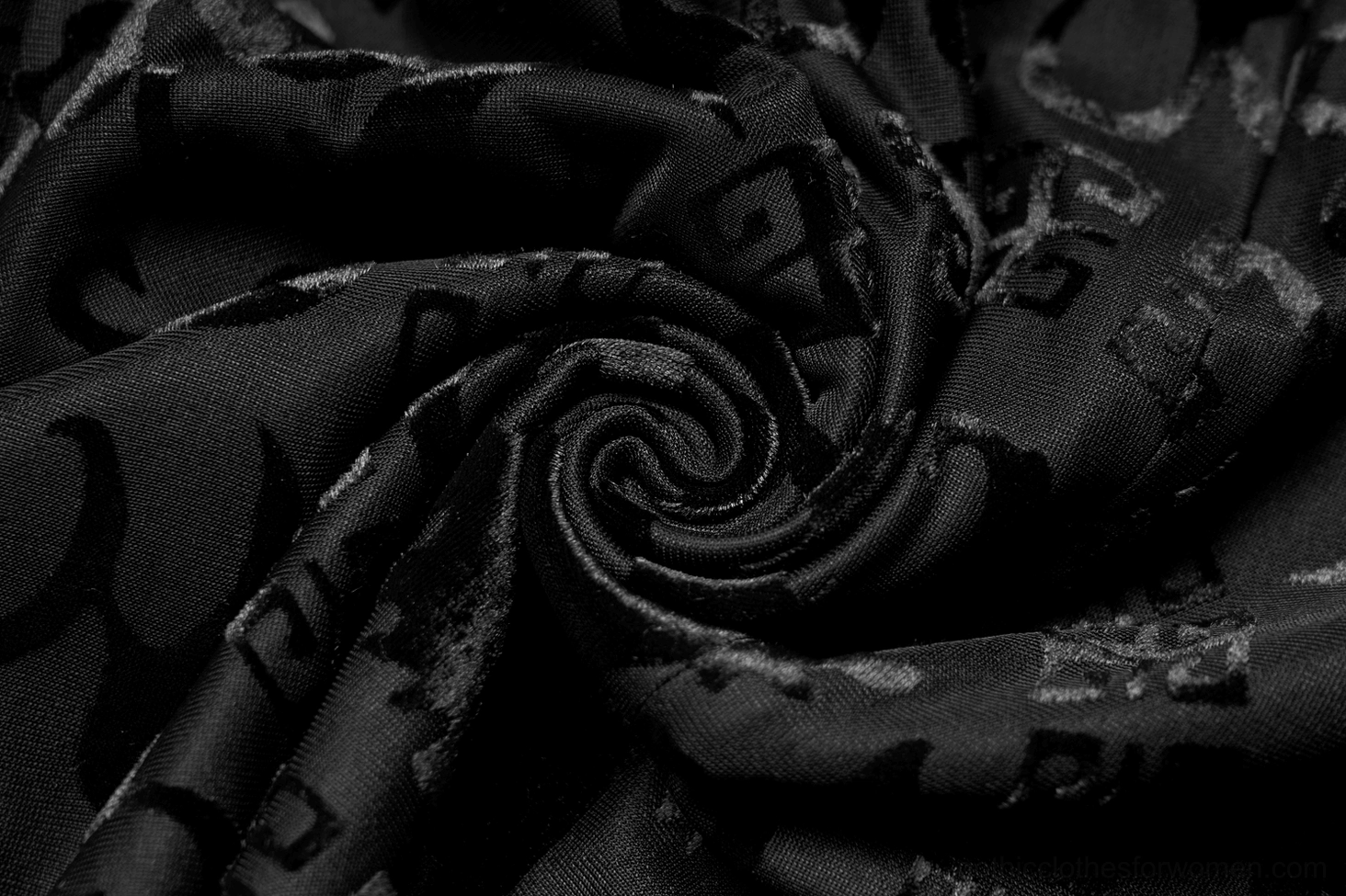 Black velvet dragon dress fitted silhouette A-line cut padded shoulders