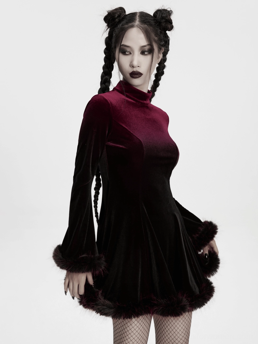 Black faux fur feather hem trim on wine red velvet gothic dress close-up