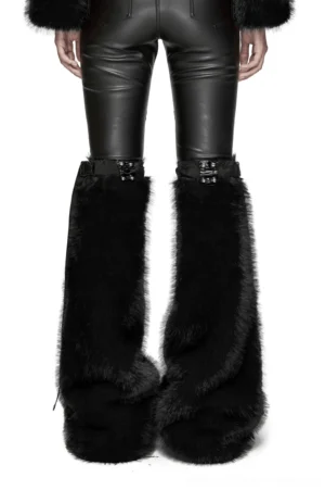 Model wearing black faux fur gothic leg warmers front view, displaying patent leather buckle closures with semi-circular rivets and plush fur pile detail