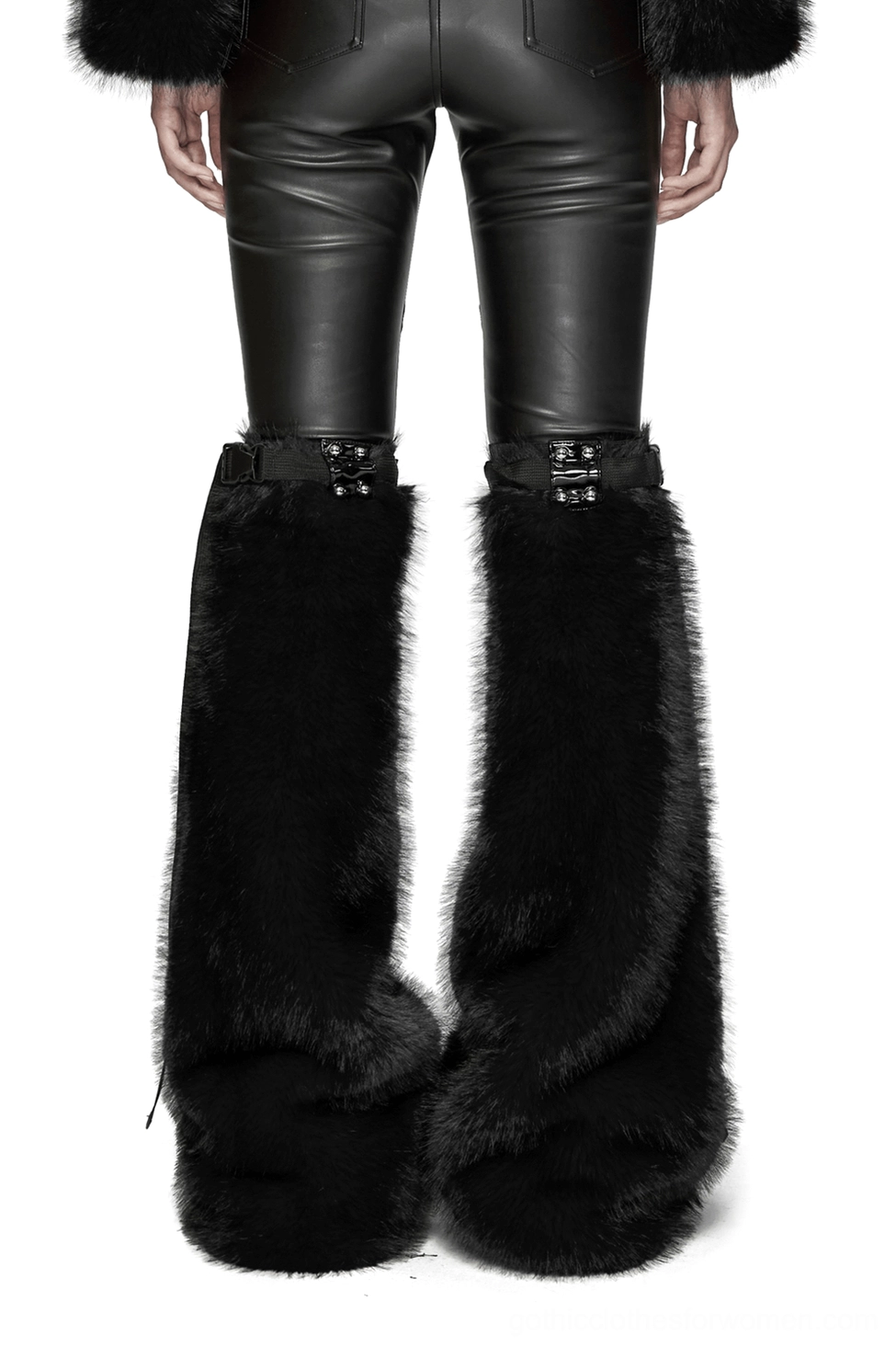 Model wearing black faux fur gothic leg warmers front view, displaying patent leather buckle closures with semi-circular rivets and plush fur pile detail