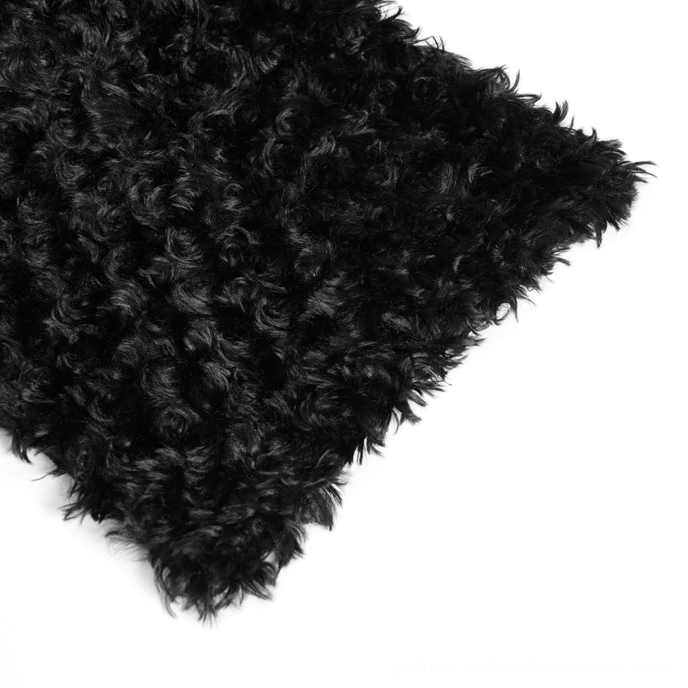 Black faux fur fabric close-up, showing dense curly texture and quality