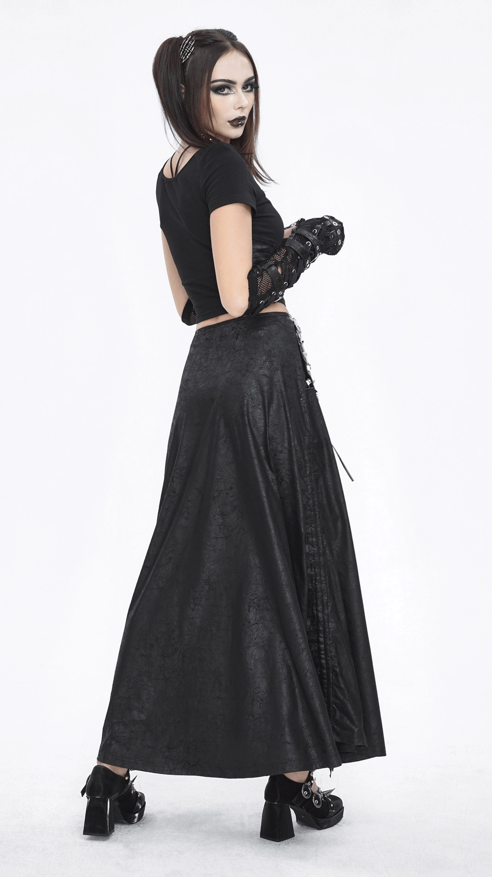 Black faux leather long skirt with distinctive buckled waist and lace-up details, perfect for gothic subculture and dark academia fashion enthusiasts