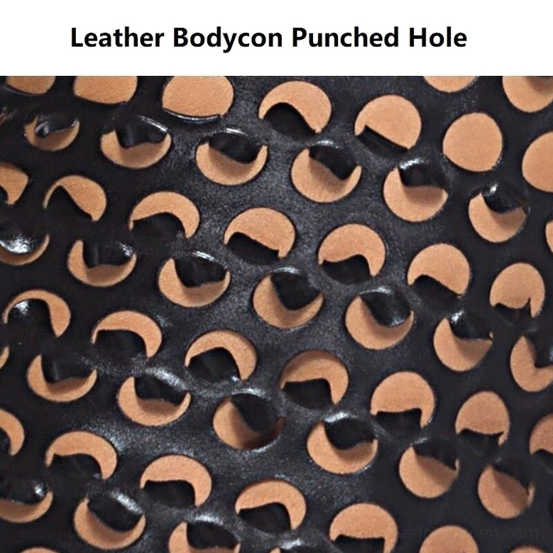 Close-up detailed shot of black faux leather fabric texture showing crescent cutout detail and material quality