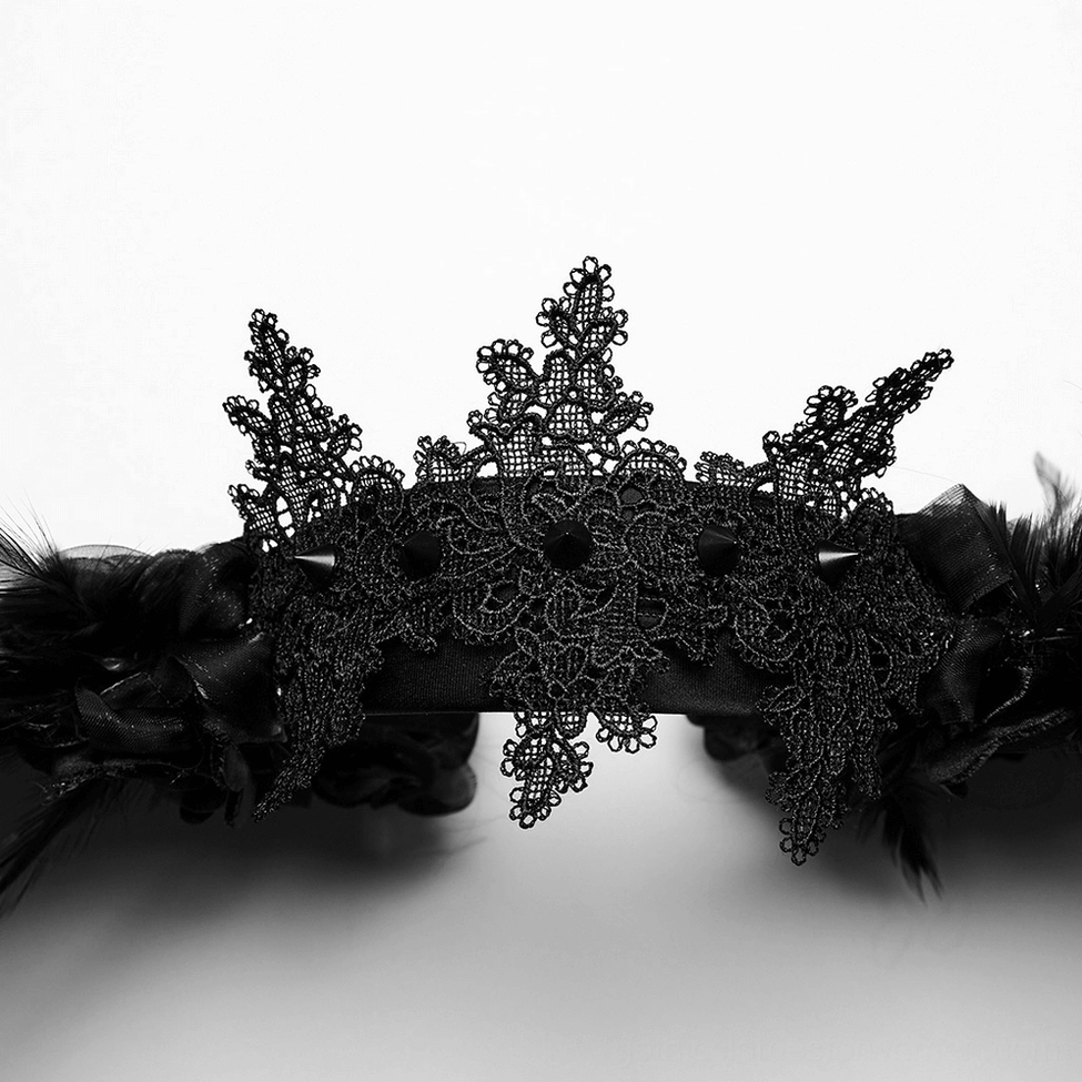 Macro close-up of gothic headband base featuring intricate black lace crown detail and decorative spike alignment
