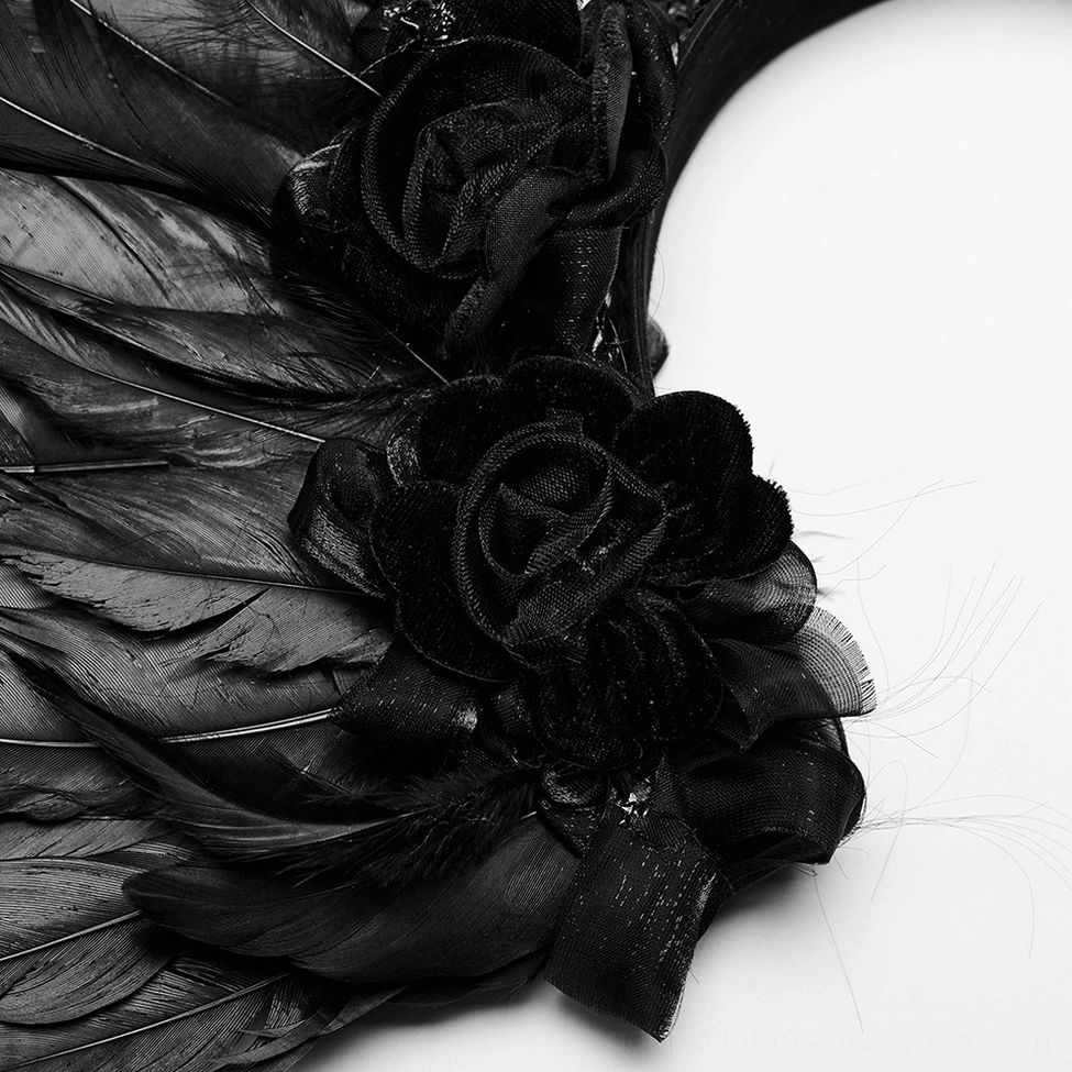 Detailed macro photography of feather wing showcasing velvet black roses and layered feather texture of gothic headpiece