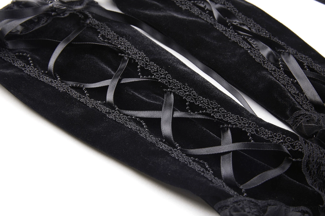 Pair of black fingerless gloves flat lay top view showing satin cross lace-up design, soft velvet texture, and delicate decorative trim details