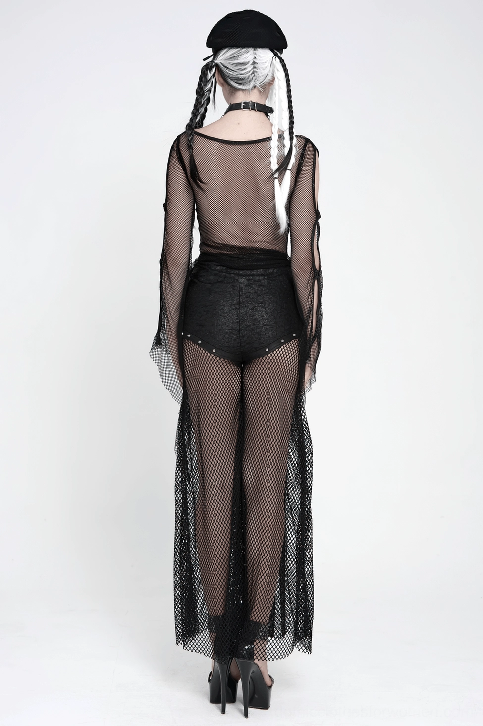 Full body styling shot of black fishnet chain lace-up pants with alternative fashion accessories