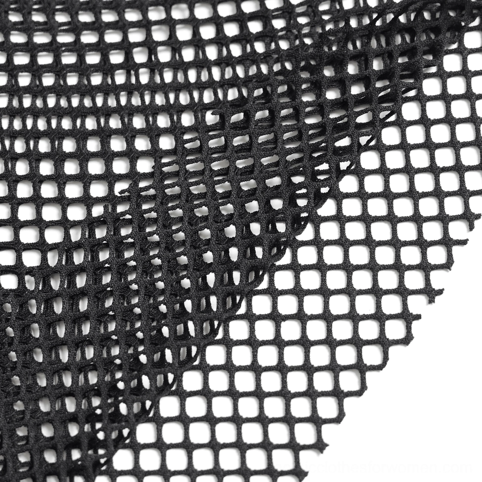 Full-length flat lay of black fishnet gothic pants showing maxi silhouette and leg opening flare