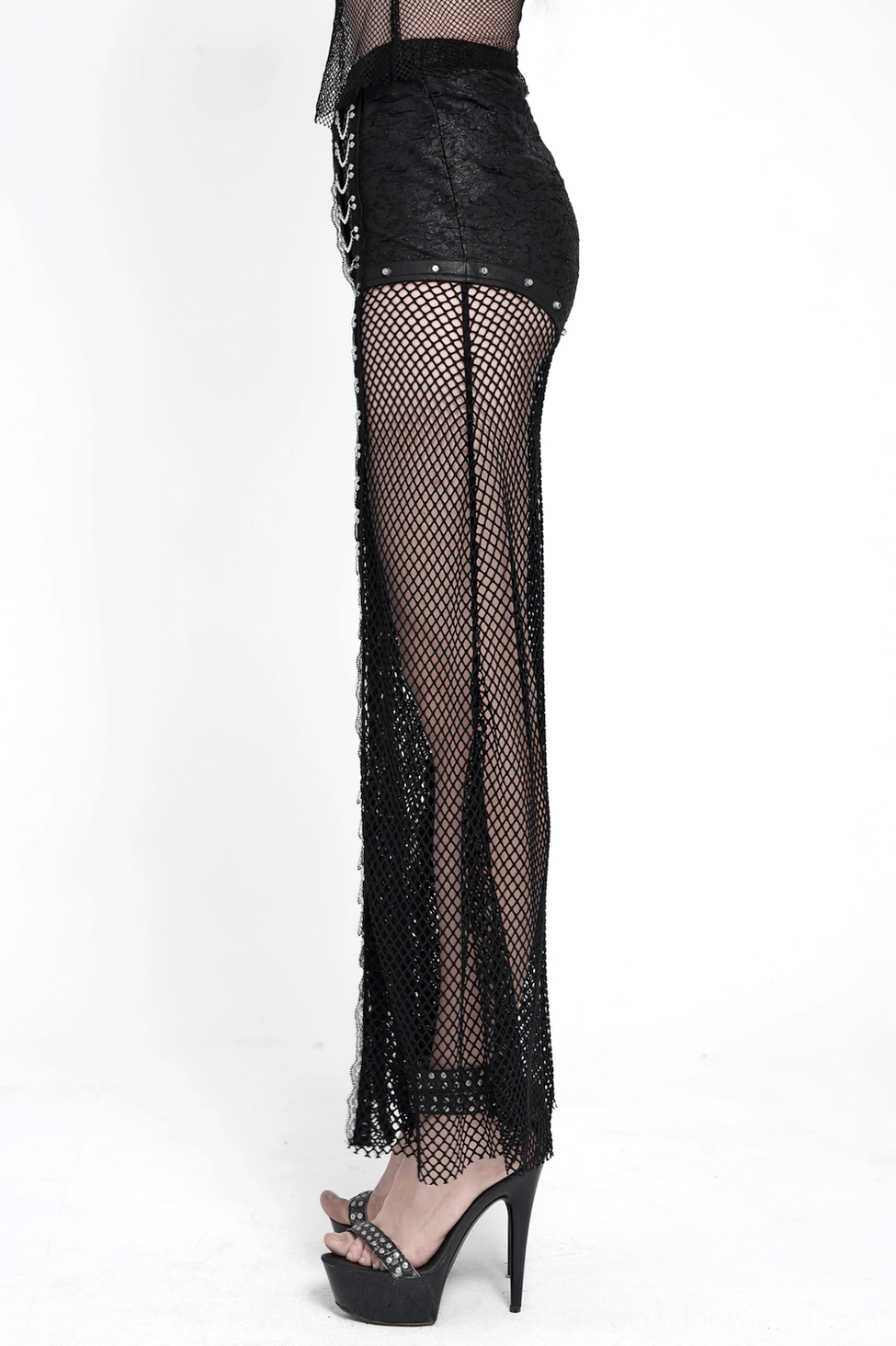 Black fishnet flare pants on model displaying movement and flow of wide-leg silhouette