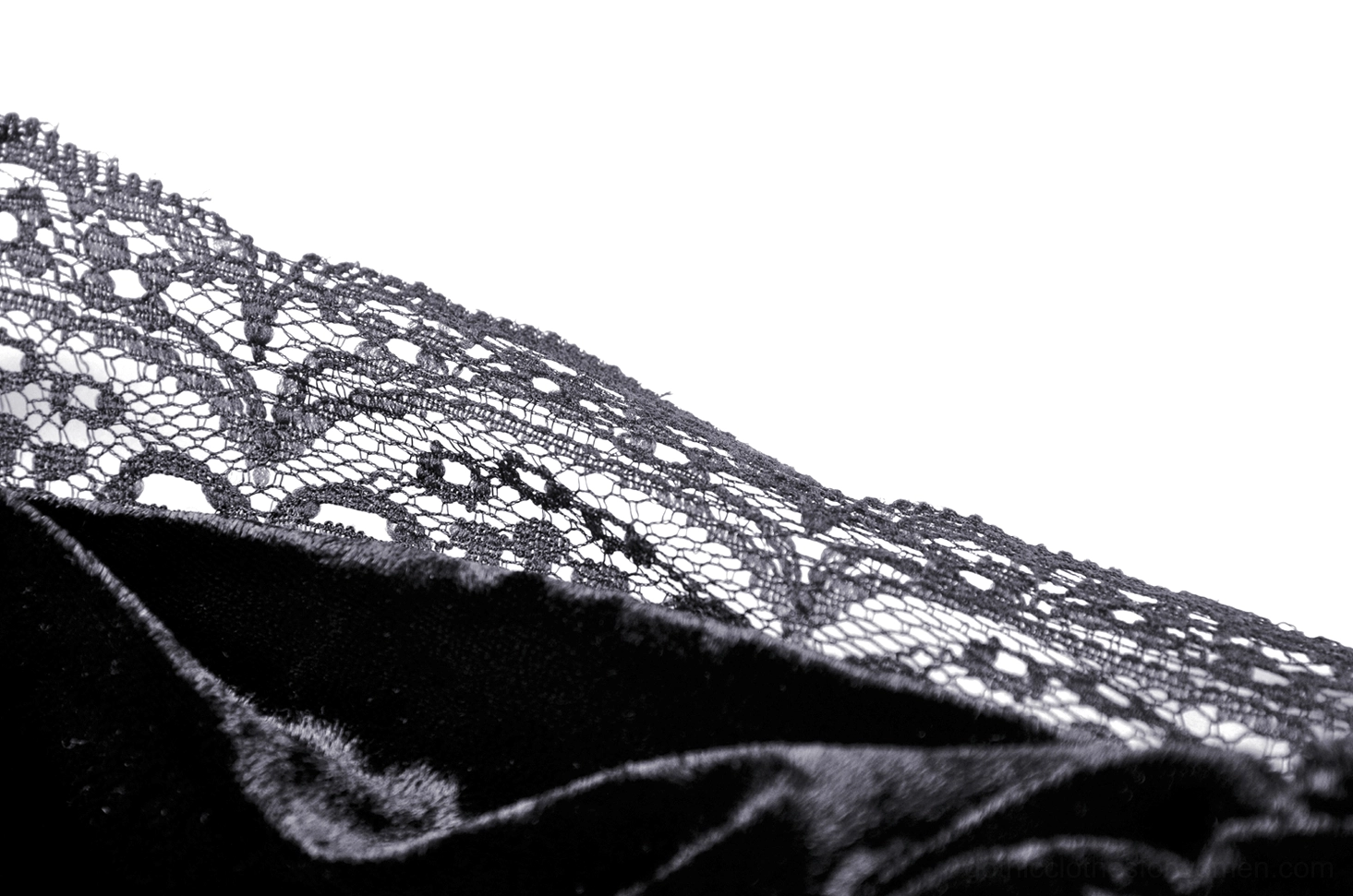 Black floral lace trim close-up with eyelash fringe, intricate pattern detail macro shot