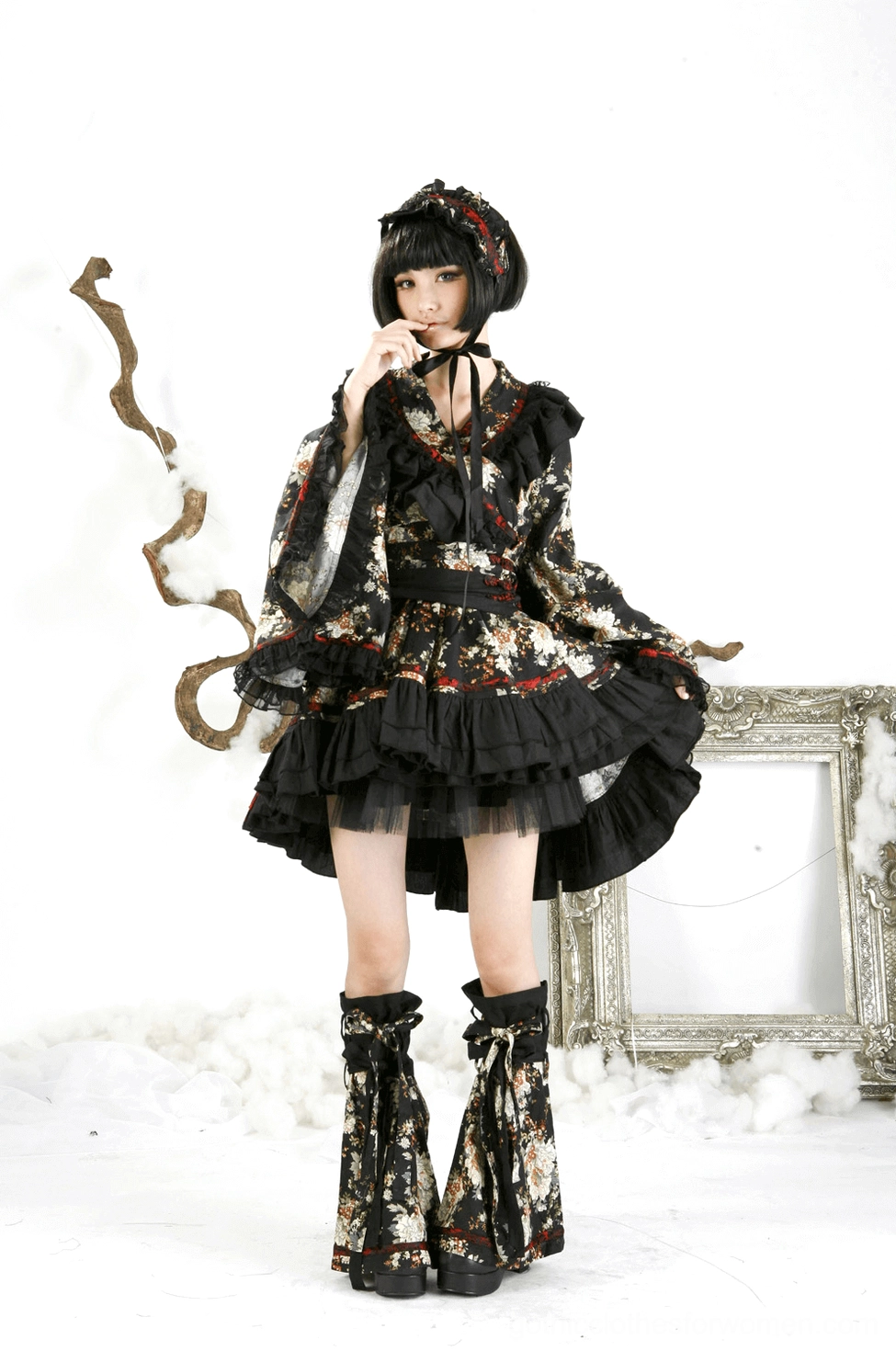Black floral lolita dress detail view emphasizing intricate floral print and fabric quality