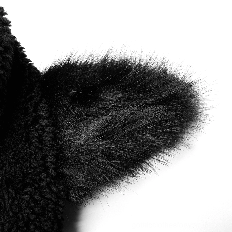 Close-up detail of fluffy black fox ear on gothic hooded fleece jacket hood, side view