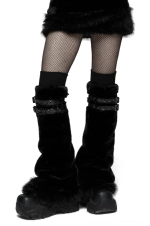 Side profile of black furry leg warmers showing fluffy texture, metal buckle fasteners, and layered styling with dark alternative fashion