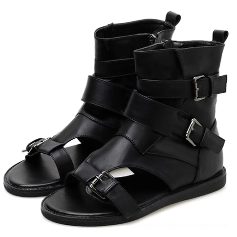 Black gladiator ankle sandals with adjustable buckle straps and open toe design, front three-quarter view showing gothic warrior style
