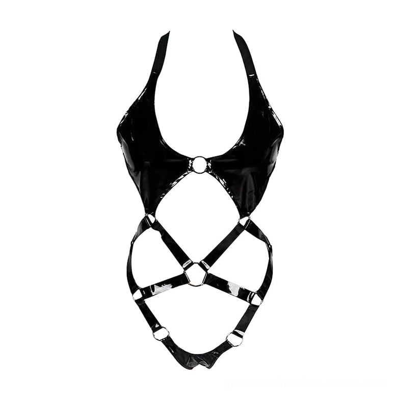 Flat lay view of black patent leather bodysuit harness showing glossy PU finish and multiple metal ring details