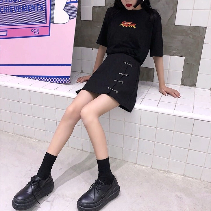 Black gothic A-line mini skirt with safety pin clips and side slit details, alternative styling view