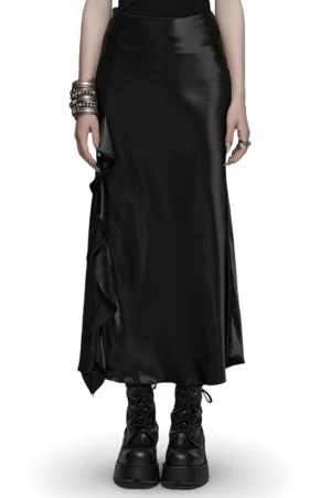 Black gothic A-line maxi skirt with asymmetric ruffle draping worn by model front view
