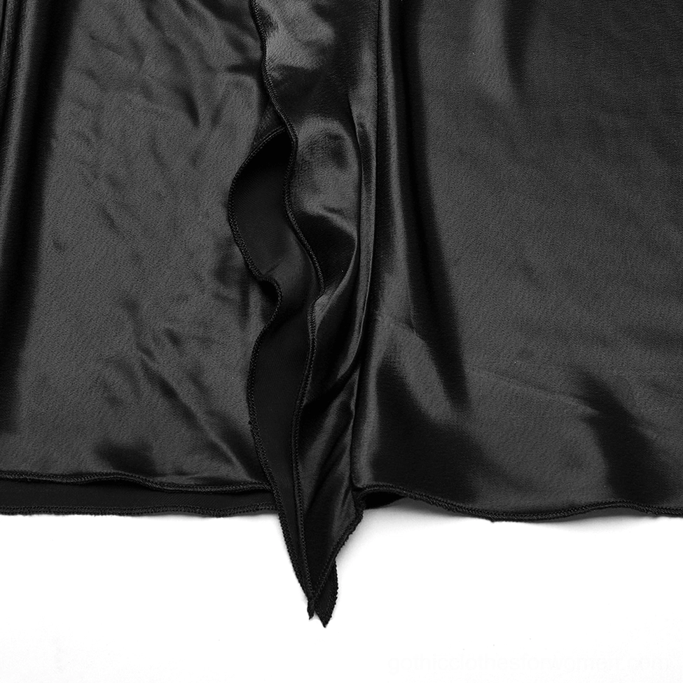 Close-up of asymmetric ruffle hem edge on black gothic maxi skirt showing stitch quality
