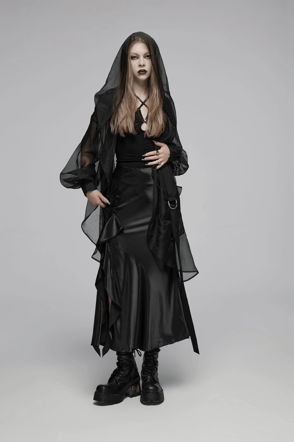 Black gothic satin A-line skirt styled view showing sheen and asymmetric ruffle movement