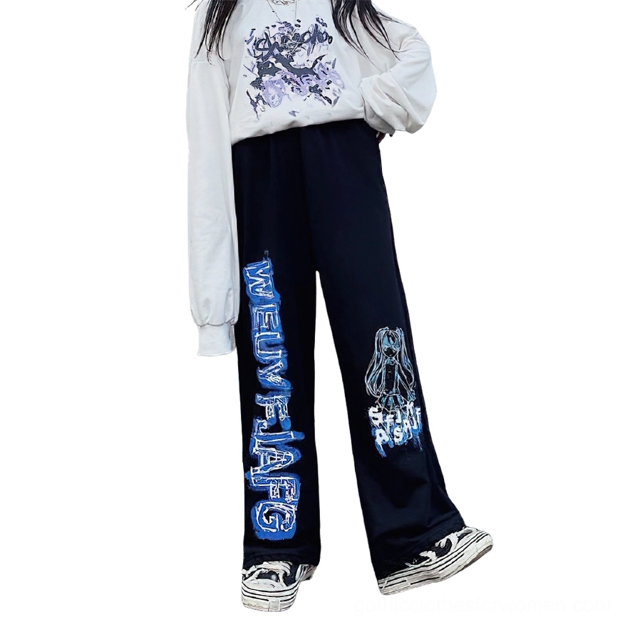 Black oversized wide leg gothic anime print jogger pants side profile view on model, loose fit silhouette