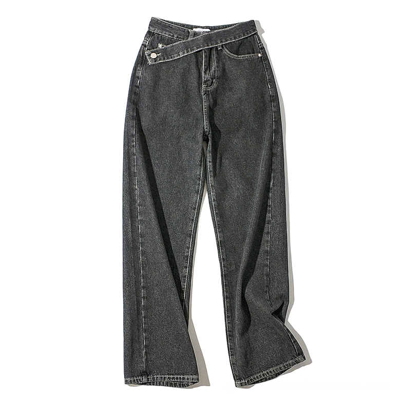 Black asymmetric waistband gothic wide-leg denim jeans flat lay front view with metal snap button detail