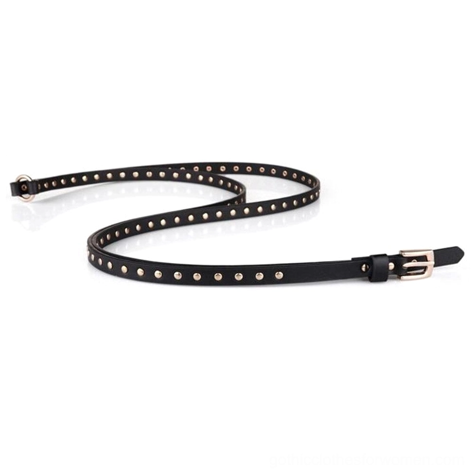 Full-length coiled black gothic studded belt with gold rivets and buckle hardware, top-down flat lay showing complete design