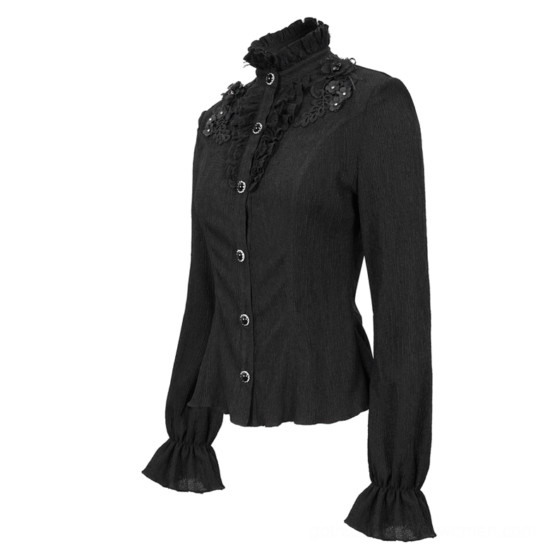 Black gothic stand collar blouse front three-quarter flat view with ruffled stand collar and floral appliqué details