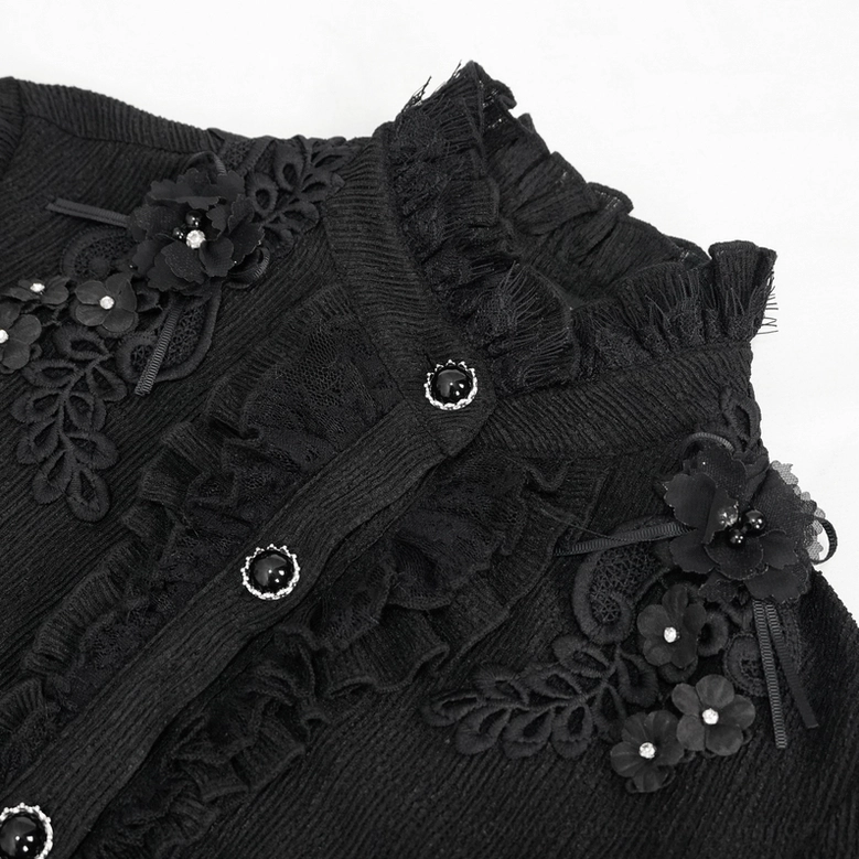 Close-up macro shot of gothic blouse stand collar showing decorative gem buttons, lace floral trim, and ruffled fabric texture
