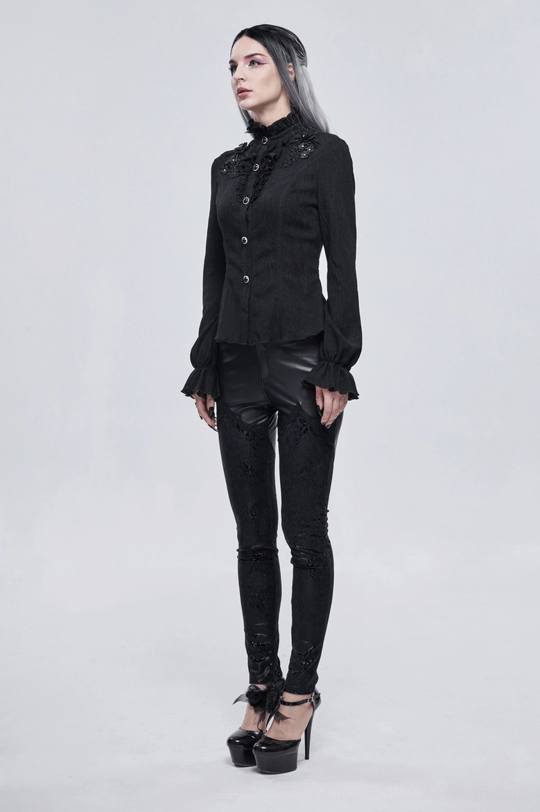 Overhead product shot of black gothic stand collar blouse with floral appliqué, showing overall garment design and details
